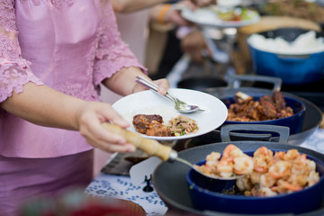 scooping the food. Buffet food at restaurant. Catering food
