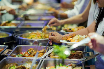scooping the food. Buffet food at restaurant. Catering food