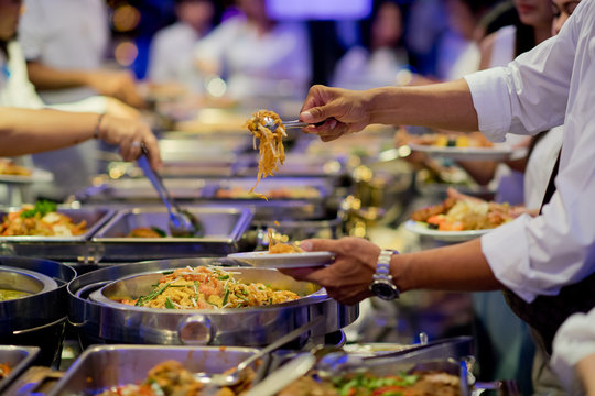 scooping the food. Buffet food at restaurant. Catering food
