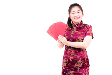 Beautiful asian woman wears cheongsam on white background. Holding red envelopes and smile in chinese new year.