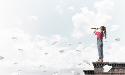 Concept of careless happy childhood with girl exploring this wor