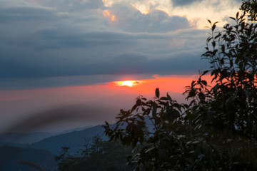 Landscape of beautiful sunset, sunrise the sun, fog and cloud are on the top of mountains, favor place for tourism who like hiking or trekking to see view, Doi Langka Lung, Thailand

