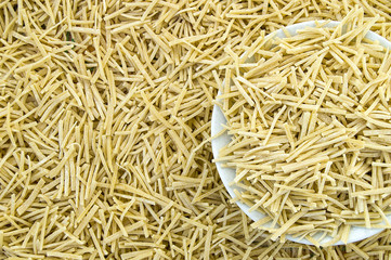 make pasta with homemade pasta, dough, make pasta and noodles at home,turkish-style homemade thin bar-shaped noodles-pasta.


