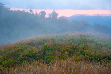Landscape of beautiful sunset, sunrise the sun, fog and cloud are on the top of mountains, favor place for tourism who like hiking or trekking to see view, Doi Langka Lung, Thailand
