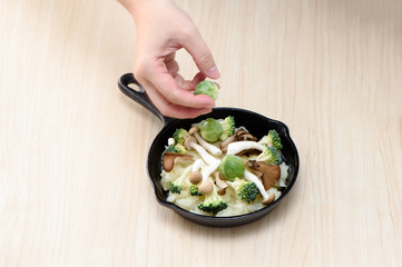 cabbages, cauliflower, mushroom and mashed potatoes in the cast iron pan
