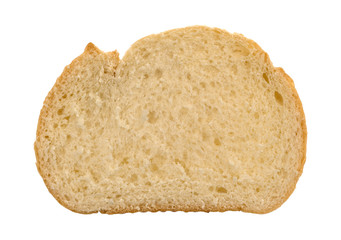 Top view of a slice of freshly baked homemade white bread isolated on a white background.