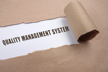 Torn paper with general management conceptual text.