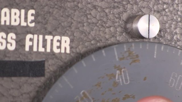 Close-up macro of number dial rotated to increase frequency on variable band-pass filter vintage electronic hardware engineering military lab test equipment