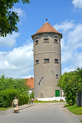 Fototapeta na wymiar Old water tower in summer day. Gvardeysk, Kaliningrad region