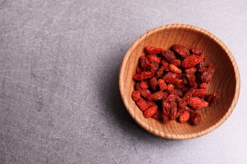 Goji seeds. Healthy Eating. Vitamins from Asia. on a gray background.
