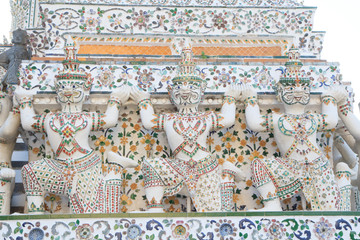 Bangkok , Thailand - 22 December, 2017: giant statue at white pagoda in Wat Arun Ratchawararam Ratchawaramahawihan