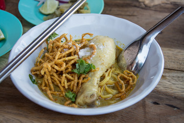 Curried Noodle Soup (Khao soi) with chicken , Traditional of Northern Thai food.