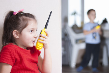 children play with walkie-talkie