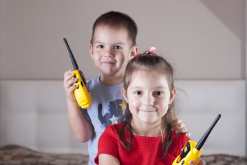 children play with walkie-talkie