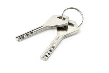 Pair of silver keys isolated on white background