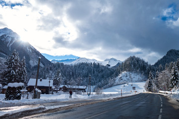 Snowy mountains behind little village in Austria