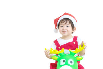 Closeup happy asian kid in santa costume riding reindeer toy isolated on white background in christmas concept