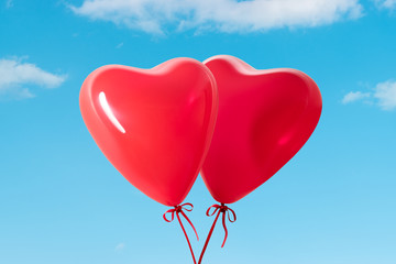 Fototapeta na wymiar Heart shaped balloons on background of sky.