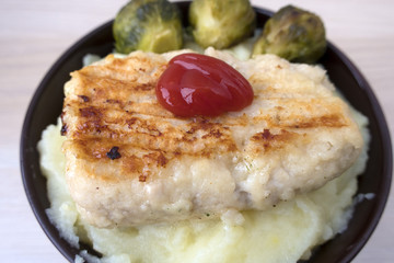 potato puree with a cutlet and cabbage