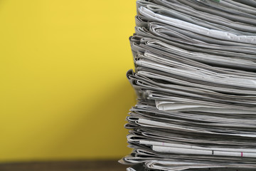 close up newspapers folded and stacked background on the table