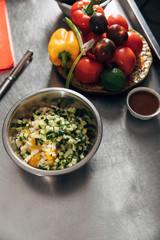fresh salad and plate of vegetables at restaurant kitchen