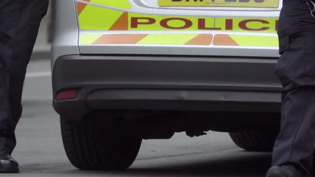 Back of a British police vehicle at a crime scene