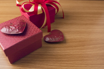 red gift box with heart love on wood ground in valentine concept