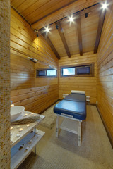 A massage table for massage in the separate room with candles