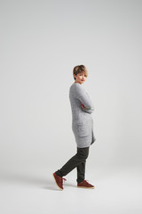 Young woman with crossed hands looking at camera