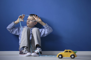 Autistic child playing blue gum