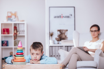 Obraz na płótnie Canvas Boy with autism during therapy