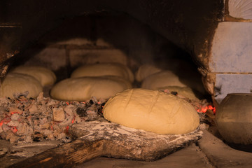 White bread is cooked in an old oven