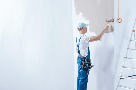 Painter in blue overalls
