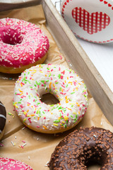 Colorful donuts with chocolate and icing, selective focus