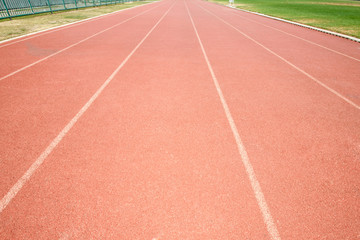 Fototapeta premium Red treadmill at the stadium