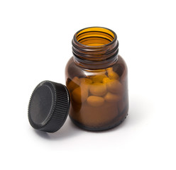 Medicine bottle with its cap screwed off