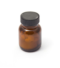 Yellow and brown see-through medicine bottle