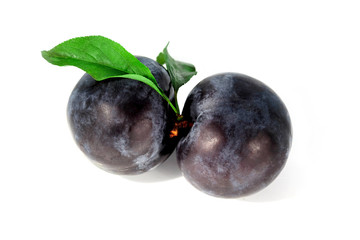 plums with a grean leaf isolated on a white background
