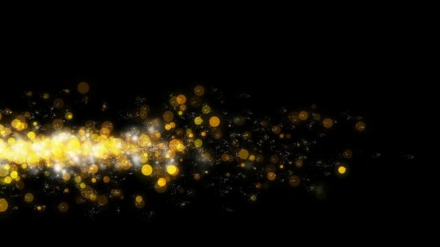 Glittering particles sparkle gold on black background.