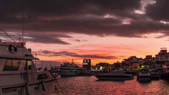 Day to night timelapse of Leisure port in Marbella at sunset. Beautiful landscape in marbella harbor