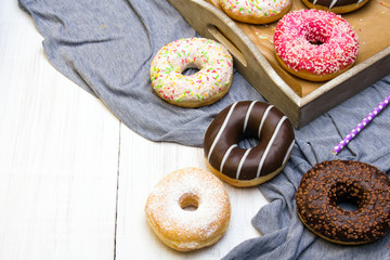 Colorful donuts with chocolate and icing, selective focus