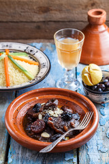Traditional moroccan tajine of beef and prunes and almonds, close view.