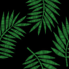 Fototapeta premium Seamless pattern with green palm leaf embroidery stitches imitation on the black background