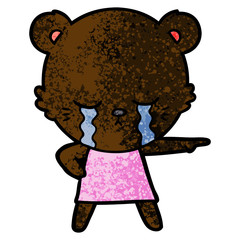 crying cartoon bear in dress pointing