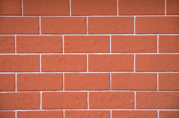 Obraz premium New decorative red plaster imitating cladding slabs