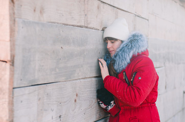 A winter morning is a girl near the hut