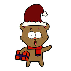 Fototapeta premium laughing teddy bear with christmas present