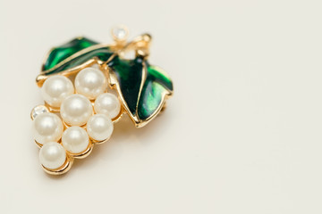 jewelry brooch with green leaves