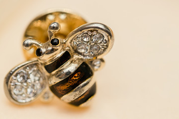 Bee shape brooch on white background