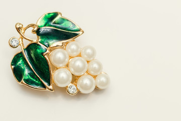 jewelry brooch with green leaves